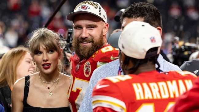 LAS VEGAS, NEVADA - FEBRUARY 11: Travis Kelce #87 of the Kansas City Chiefs and Taylor Swift react as they see Mecole Hardman Jr. #12 of the Kansas City Chiefs following the NFL Super Bowl 58 football game between the San Francisco 49ers and the Kansas City Chiefs at Allegiant Stadium on February 11, 2024 in Las Vegas, Nevada. (Photo by Michael Owens/Getty Images)