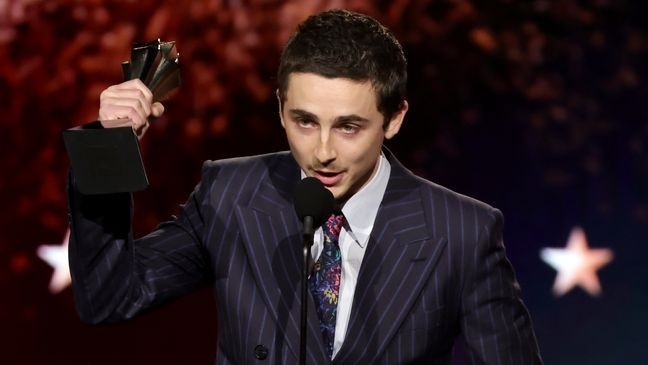 SANTA MONICA, CALIFORNIA - JANUARY 04: Timothée Chalamet, winner of the Best Actor Award for "Marty Supreme", speaks onstage during the 31st Annual Critics Choice Awards at Barker Hangar on January 04, 2026 in Santa Monica, California. (Photo by Kevin Winter/Getty Images for Critics Choice Association)