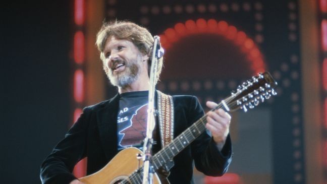 Kris Kristofferson, US country singer and actor, playing the guitar on stage during a live concert performance at the International Festival of Country Music, at Wembley Arena, London, England, United Kingdom, in April 1982. (Photo by Keystone/Hulton Archive/Getty Images)