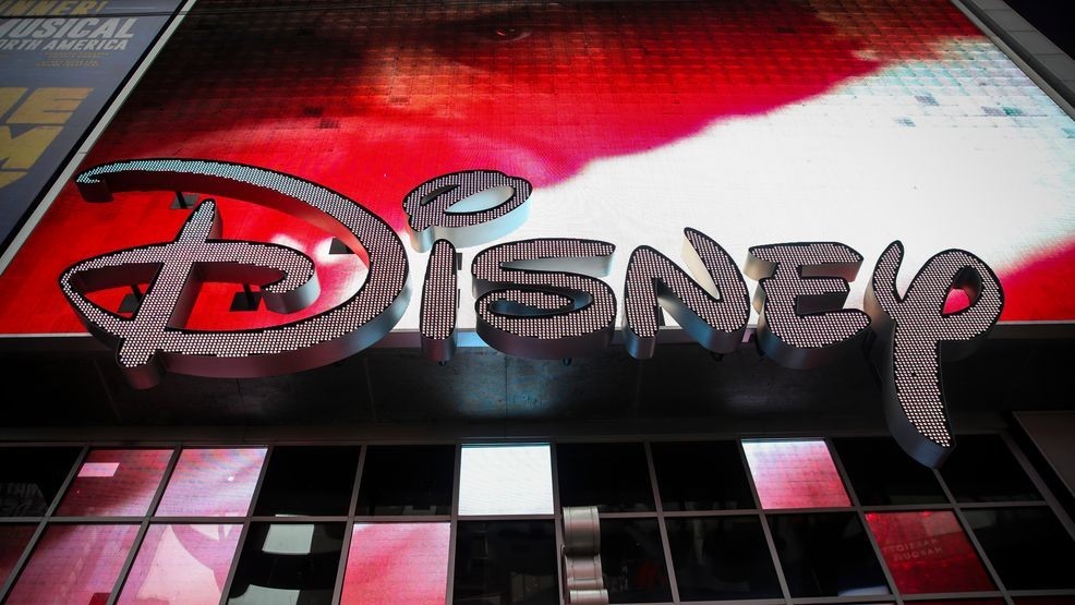 FILE - The Disney logo is displayed outside the Disney Store in Times Square, December 14, 2017, in New York. (Photo by Drew Angerer/Getty Images)