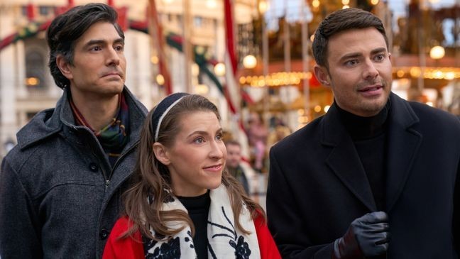 Siblings Dylan, Cal, and Emory are at a crossroads in their lives and have drifted apart. To help, their parents plan a family Christmas river cruise visiting Germany and Austria.  Photo: Brandon Routh, Eden Sher, Jonathan Bennett  Credit: ©2025 Hallmark Media/Photographer:{&nbsp;}Adriana Yankulova