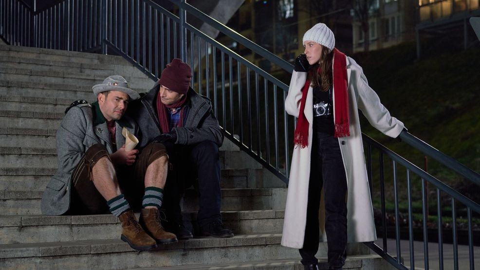 Siblings Dylan, Cal, and Emory are at a crossroads in their lives and have drifted apart. To help, their parents plan a family Christmas river cruise visiting Germany and Austria.  Photo: Jonathan Bennett, Brandon Routh, Eden Sher  Credit: ©2025 Hallmark Media/Photographer:{&nbsp;}Adriana Yankulova