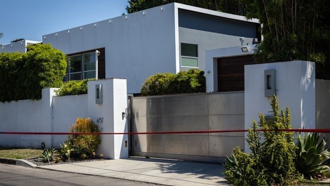 Los Angeles Police Department officials secure the home where Robin Kaye an "American Idol" music supervisor and her husband Thomas Deluca were found killed with gunshot wounds to the head on Tuesday, July 15, 2025 in Encino, CA. (Jason Armond / Los Angeles Times via Getty Images)