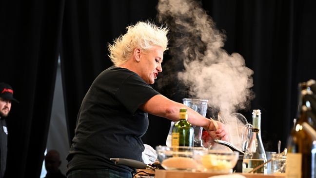NEW YORK, NEW YORK - OCTOBER 15: Anne Burrell makes a culinary presentation during the Food Network New York City Wine & Food Festival presented by Capital One - Grand Tasting featuring Culinary Demonstrations presented by Liebherr Appliances on October 15, 2022 in New York City. (Photo by Dave Kotinsky/Getty Images for NYCWFF)