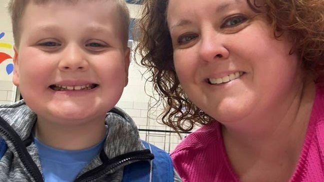 This image provided by Holly LaFavers shows Holly LaFavers posing for a photo with her 8-year-old son Liam Wednesday, April 23, 2025, in Lexington, Ky. (Holly LaFavers via AP)