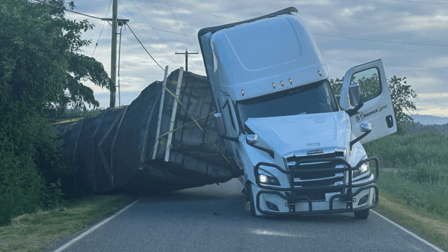 A semi-truck carrying millions of pollenating bees partially rolled over on a Whatcom County Road on May 30, 2025. (PHOTO: Whatcom County Sheriff's Office)
