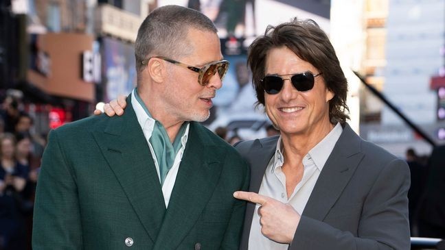 Brad Pitt, left, and Tom Cruise pose for photographers upon arrival at the premiere of the film 'F1 The Movie' on Monday, June 23, 2025, in London. (Photo by Scott A Garfitt/Invision/AP)