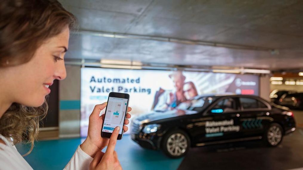 Cars proceed without a driver to an assigned parking space in response to a command issued by smartphone, without any need for the driver to supervise the maneuver. Driverless parking is made possible by an intelligent multi-story car park infrastructure from Bosch in conjunction with the vehicle technology from Mercedes-Benz. (Image courtesy of Daimler AG)