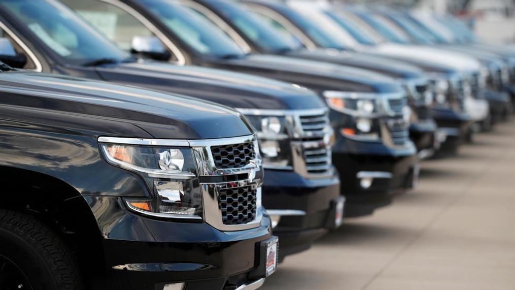 In this Sunday, June 24, 2018, photograph, unsold 2018 Suburbans sit at a Chevrolet dealership in Englewood, Colo. Neither higher gas prices nor rising interest rates could put a damper on U.S. auto sales during the first half of 2018. Sales rose 1.8 percent during the first half of the year, while June sales were up about 5 percent compared with a year earlier, according to Edmunds.com. (AP Photo/David Zalubowski)