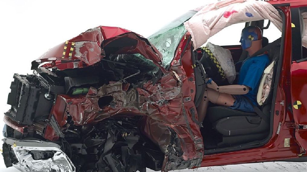 2017 Nissan Titan: The dummy's position in relation to the door frame, steering wheel, and instrument panel after the crash test indicates that the driver's survival space was not maintained well in the small overlap front crash test. (Image courtesy of the Insurance Institute for Highway Safety)