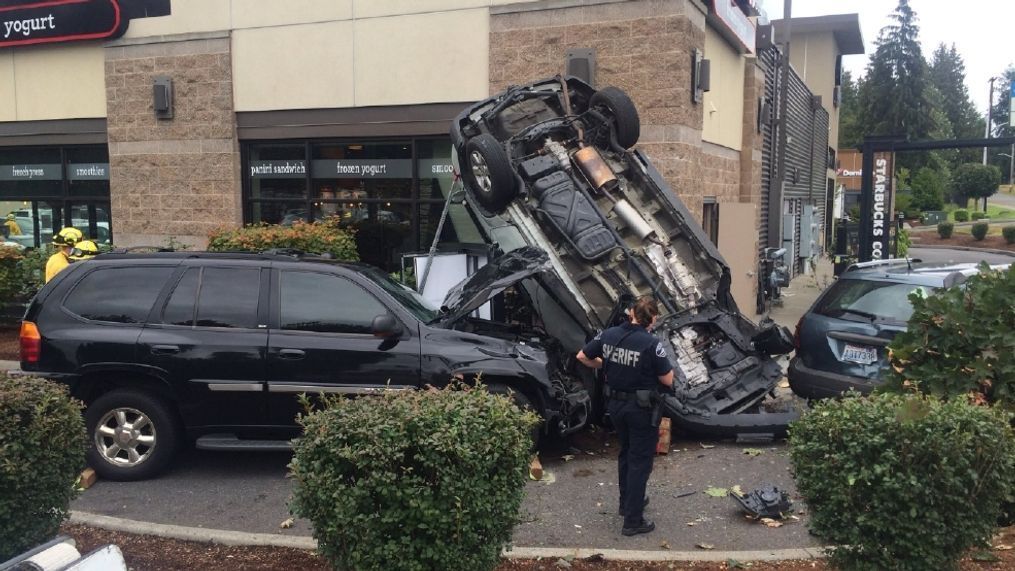 An SUV sits upside-down after crashing through a Starbucks drive-thru line in Puyallup on Aug. 9, 2016. (Photo: KOMO News).