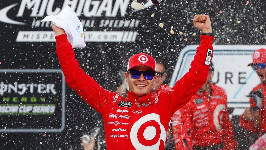 Kyle Larson celebrates winning the NASCAR Cup Series auto race in Brooklyn, Mich., Sunday, Aug. 13, 2017. (AP Photo/Paul Sancya)