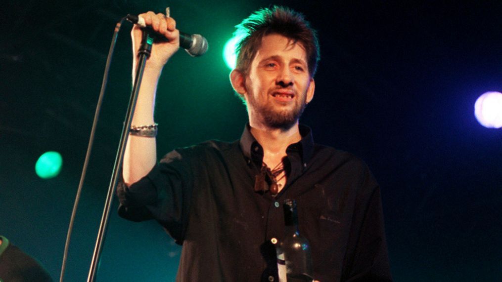 FILE - Former Pogues member Shane MacGowan performs on stage with his group The Popes, at the 10th annual Fleadh, in Finsbury Park, north London, July 10, 1999. (Michael Walter/PA via AP, File)