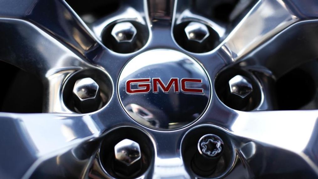 In this April 25, 2017, photo, a GMC truck sits in a General Motors dealer's lot in Nashville, Tenn. General Motors Co. reports earnings, Tuesday, Feb. 6, 2018. (AP Photo/Mark Humphrey)