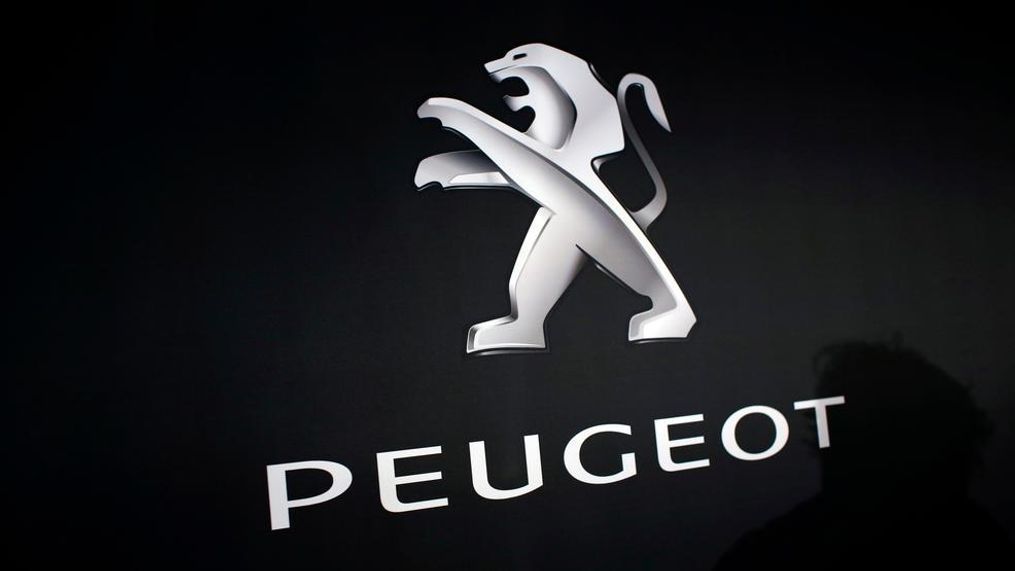 In this March 1, 2018 photo, the logo of Peugeot is displayed at PSA Peugeot Citroen headquarters during the presentation of the company's 2017 full year results, in Rueil-Malmaison, west of Paris, France. Italian-American carmaker Fiat Chrysler Automobiles on Wednesday, Oct. 30, 2019 confirmed that it is in talks with French rival PSA Peugeot, its second bid this year to reshape the global auto industry facing huge challenges with the transition to electric and autonomous vehicles.  (AP Photo/Thibault Camus)