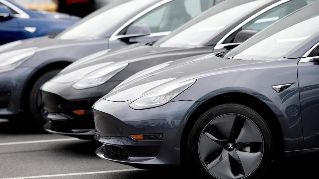 In this Sunday, May 19, 2019, file photo, a line of unsold 2019 Model 3 sedans sits at a Tesla dealership in Littleton, Colo.  Tesla is close to setting a quarterly record for deliveries, but the company is having trouble shipping vehicles to the right places as the second quarter comes to a close, CEO Elon Musk told workers in an internal memo. (AP Photo/David Zalubowski, File)