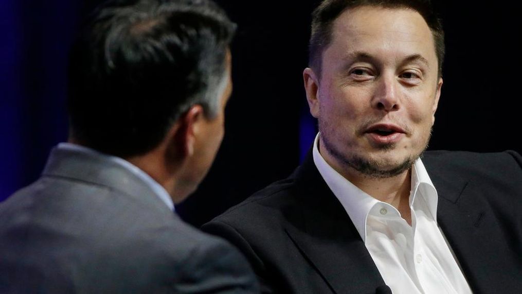 In this 2017 file photo, Tesla and SpaceX CEO Elon Musk responds to a question by Nevada Republican Gov. Brian Sandoval during the closing plenary session entitled "Introducing the New Chairs Initiative - Ahead" on the third day of the National Governors Association's meeting in Providence, R.I. Tesla says it’s put together a 10-year compensation package for Musk that pays him based on certain market cap and operational milestones he hits - otherwise he gets nothing. The electric vehicle maker says Tuesday, Jan. 23, 2018, its market cap would have to grow to $650B for Musk to fully vest. (AP Photo/Stephan Savoia, File){p}{/p}