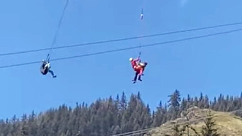 Air Zermatt AG crew rescue a paraglider stuck in a power line in Switzerland. (Newsflash)