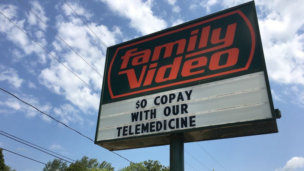 The sign in front of the Family Video on Gull Road in Kalamazoo advertises $0 co-pay for telemedicine. (WWMT/Matt Miller)