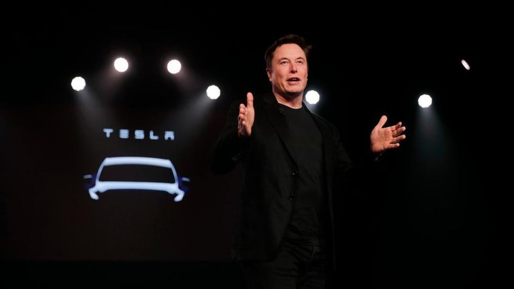 In this March 14, 2019, file photo Tesla CEO Elon Musk speaks before unveiling the Model Y at Tesla's design studio in Hawthorne, Calif. Musk appears poised to transform the company’s electric cars into driverless vehicles in a risky bid to realize a bold vision that he has been floating for years. The technology required to make that quantum leap is scheduled to be shown off to Tesla investors Monday, April 22, 2019, at the company’s Palo Alto, Calif., headquarters. (AP Photo/Jae C. Hong, File)