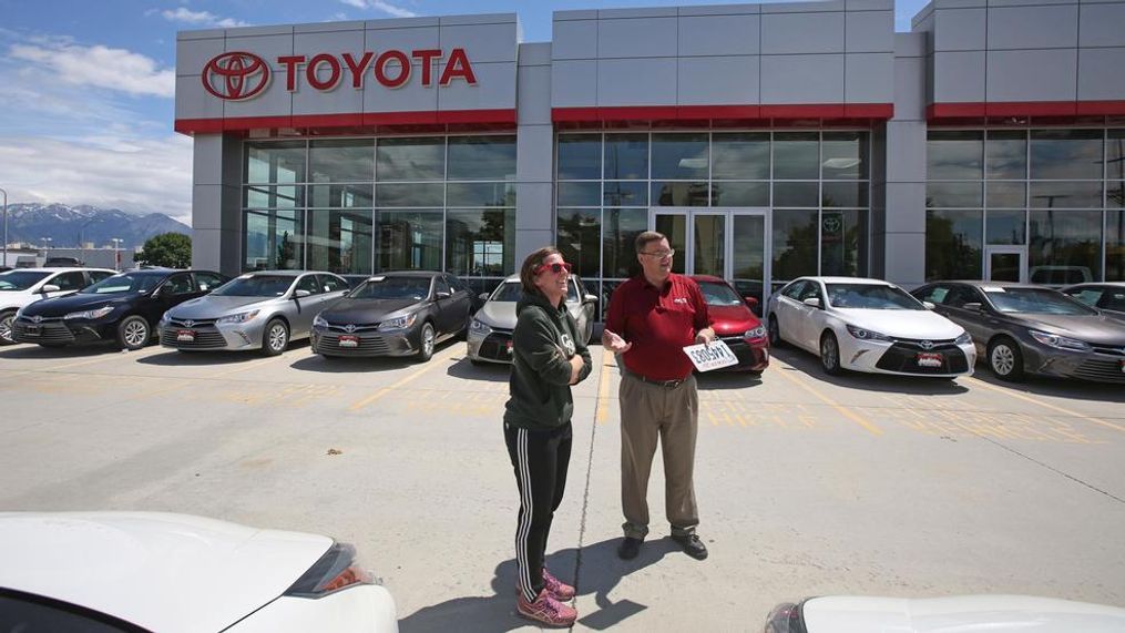 In this Tuesday, June 13, 2017, photo, car shopper Mary Jean Jones speaks with Mark Miller Toyota salesman Doug Lund, in Salt Lake City. U.S. sales of new cars and trucks were expected to show a decline in July 2017 as consumers pulled back on purchases and waited for Labor Day deals. July likely marked the seventh straight month of declines in a peaking market. (AP Photo/Rick Bowmer)