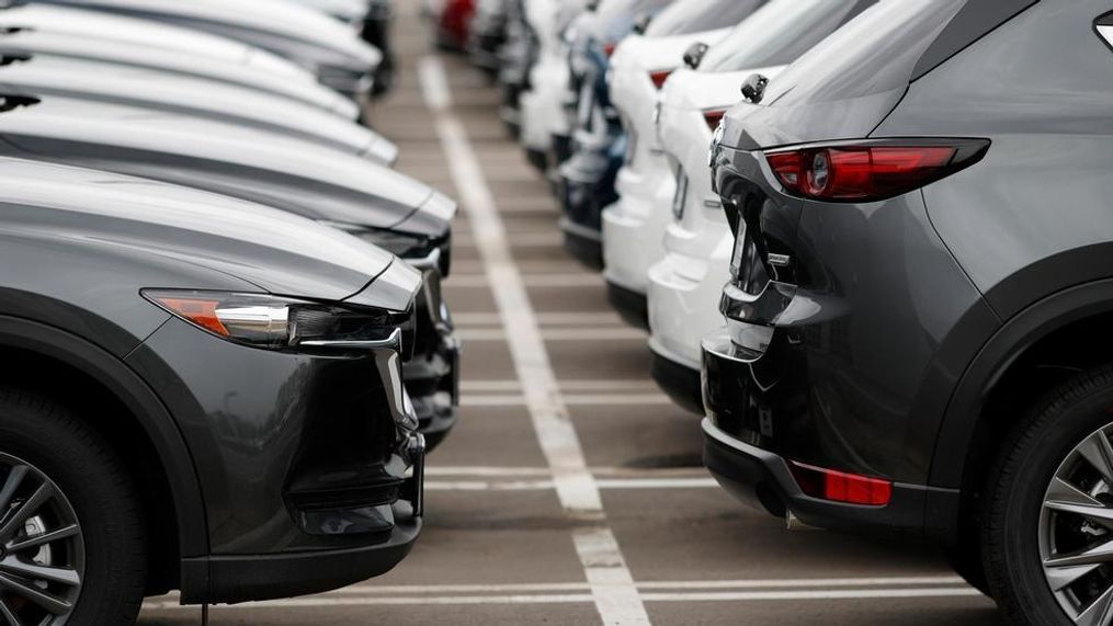 In this Sunday, May 19, 2019, file photo lines of unsold vehicles sit at a dealership in Littleton, Colo. By the 2025 model year, nearly all new vehicles sold in the U.S. will come with electronic alerts to remind people to not leave children behind in the back seats.{&nbsp;} (AP Photo/David Zalubowski, File)