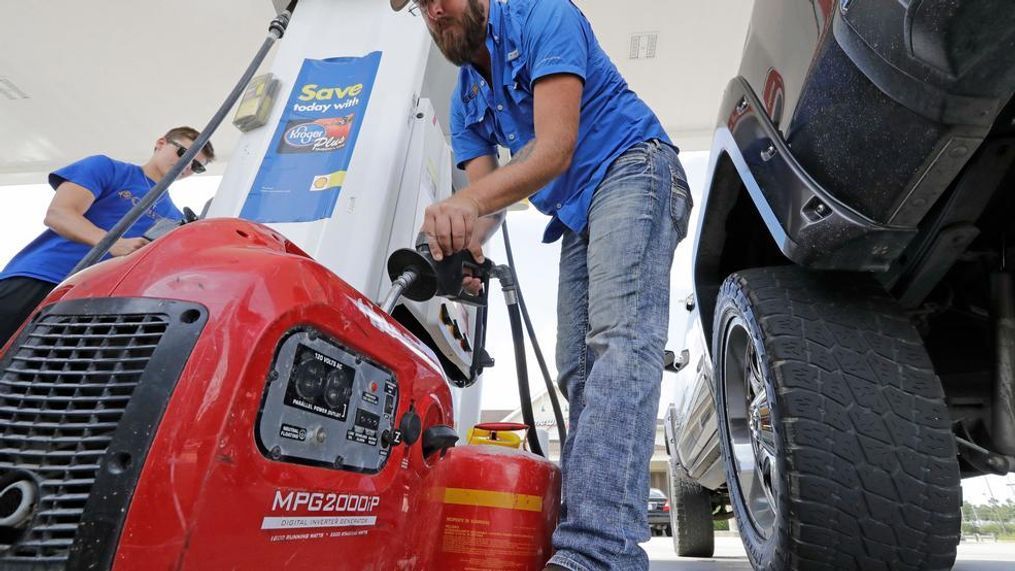 Aaron Berg fills up a gas can and his portable generator Thursday, Aug. 24, 2017, in Houston as Hurricane Harvey intensifies in the Gulf of Mexico. Harvey is forecast to be a major hurricane when it makes landfall along the middle Texas coastline. (AP Photo/David J. Phillip)