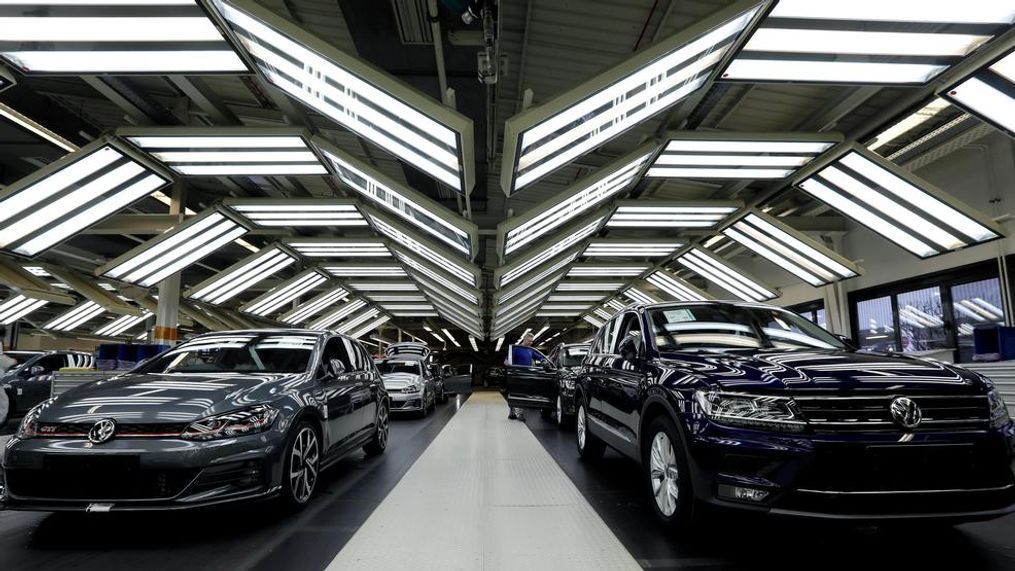 FILE - In this Thursday, March 8, 2018 file photo Volkswagen cars are pictured during a final quality control at the Volkswagen plant in Wolfsburg, Germany.  Automaker Volkswagen says it is on track for a new annual sales record despite troubles getting vehicles certified for new European emissions tests. (AP Photo/Michael Sohn, file)