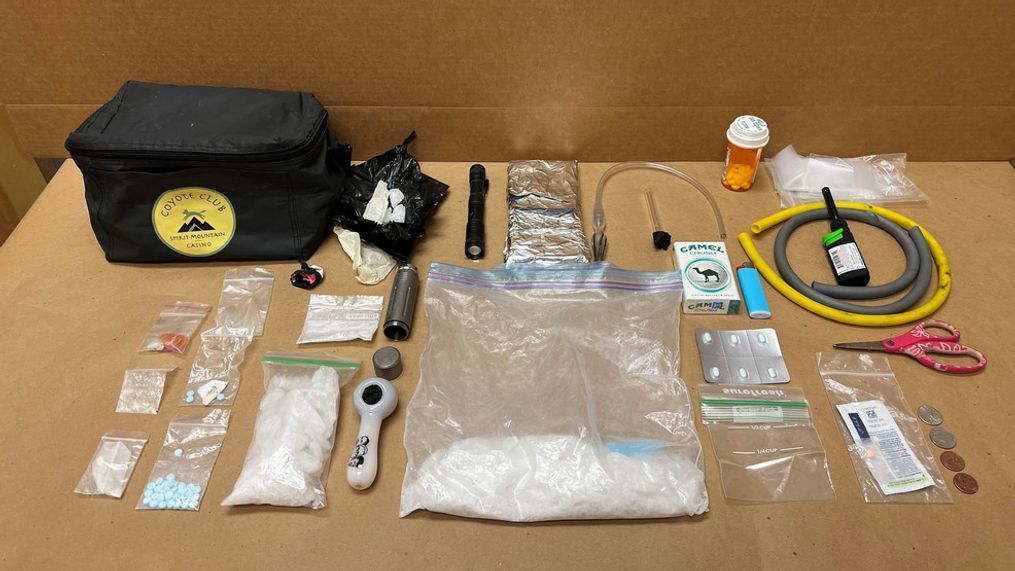 Lost fanny pack with drugs inside laid out on a table. (Photo: Garden City Police Department)