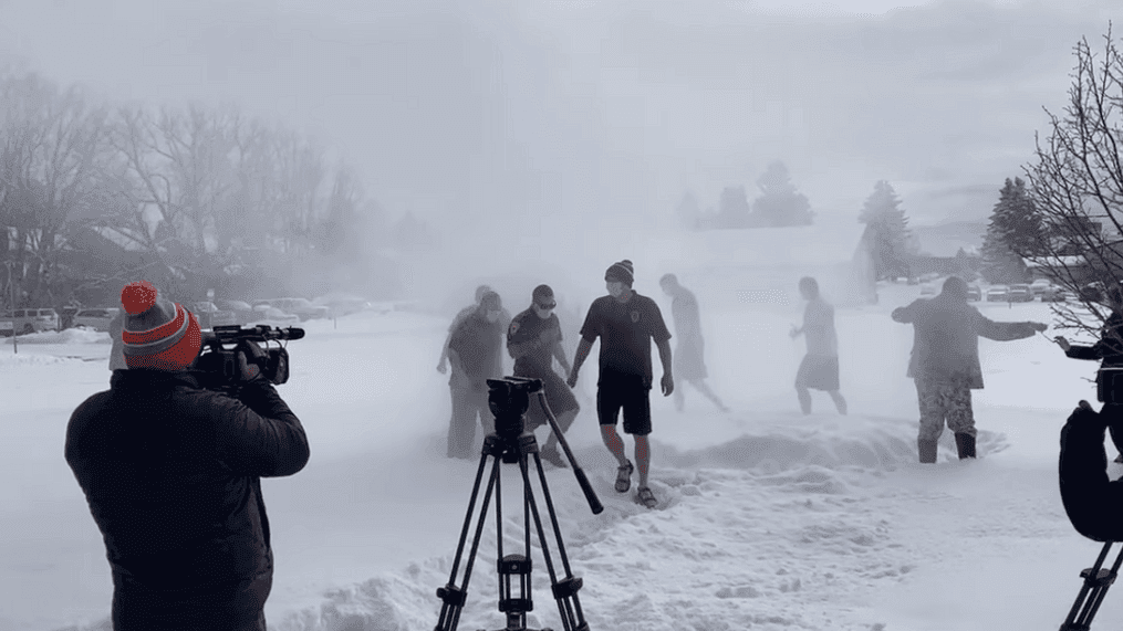 Police officers create their own version of polar the bear plunge with a firehose and snow angels on Wednesday, Feb. 10, 2020, in Bozeman, Montana. (Courtesy: Bozeman Police Department){&nbsp;}