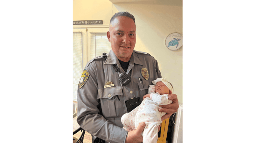 A police officer from New Jersey has reunited with a family nearly a month after he helped deliver a baby girl at their home. (Photo: Toms River Police Department)