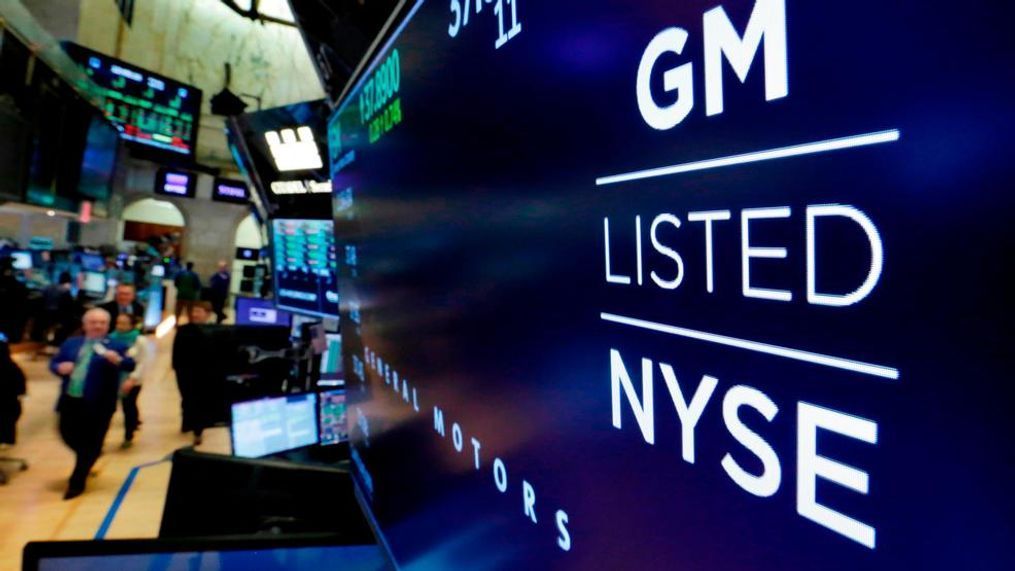 FILE- In this April 23, 2018, file photo, the logo for General Motors appears above a trading post on the floor of the New York Stock Exchange. General Motors Co. reports earns.  General Motors strengthened its pretax profit estimate for 2018 and predicted even stronger performance for 2019 as it executives made a presentation to investors on Friday, Jan. 11, 2019. (AP Photo/Richard Drew, File)