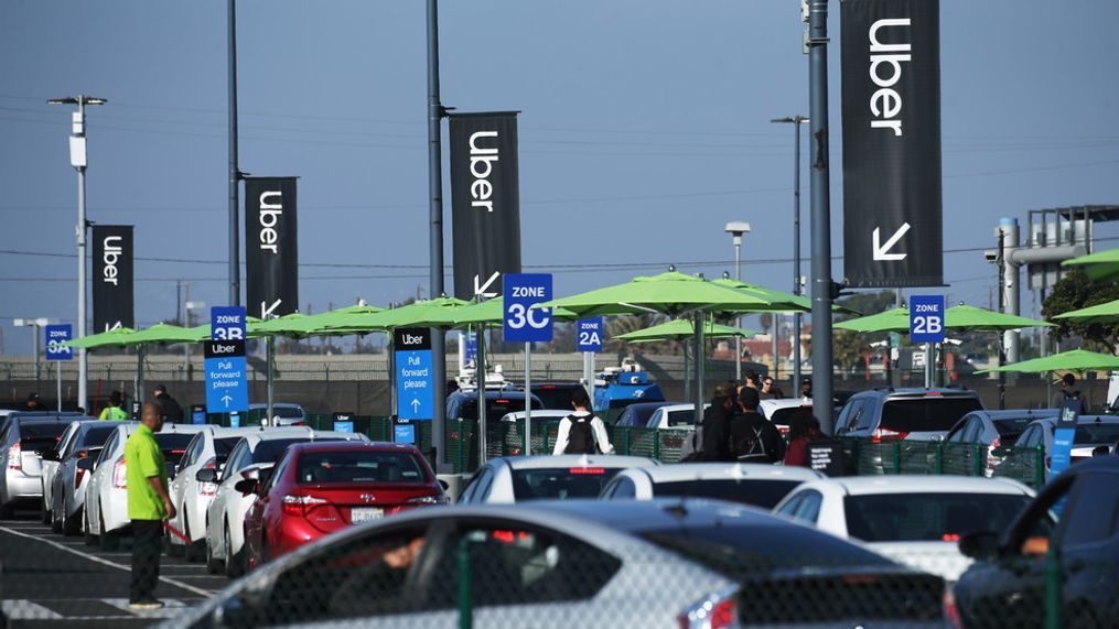 LOS ANGELES, CALIFORNIA - NOVEMBER 06: Uber vehicles are lined up at the new 'LAX-it' ride-hail passenger pickup lot at Los Angeles International Airport (LAX) on November 6, 2019 in Los Angeles, California. (Photo by Mario Tama/Getty Images)