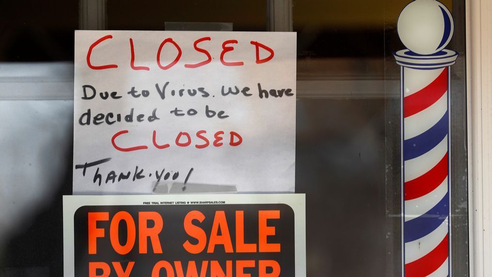 "For Sale By Owner" and "Closed Due to Virus" signs are displayed in the window of Images On Mack in Grosse Pointe Woods, Mich., Thursday, April 2, 2020. (AP Photo/Paul Sancya)