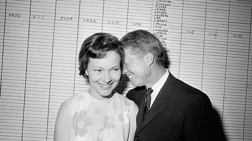 FILE - In this Sept. 15, 1966, file photo, then Georgia State Sen. Jimmy Carter hugs his wife, Rosalynn, at his Atlanta campaign headquarters. (AP Photo/File)