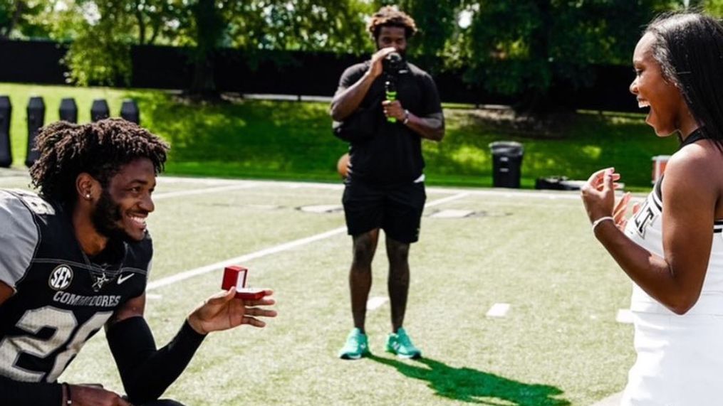 Vanderbilt football player proposes to cheerleader. (Photo by{&nbsp;}Andre Mintze){p}{/p}