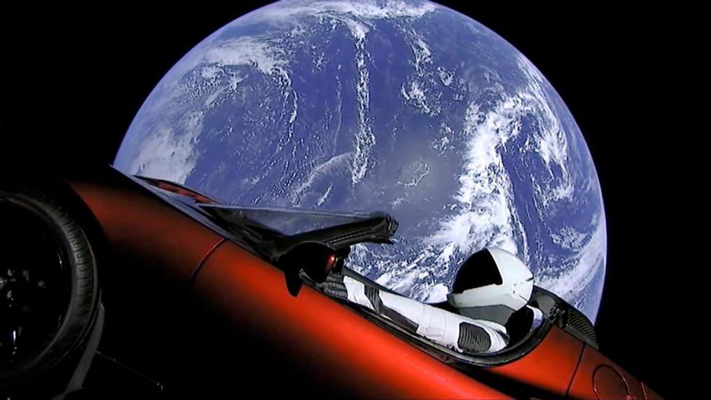 This image from video provided by SpaceX shows the company's spacesuit in Elon Musk's red Tesla sports car which was launched into space during the first test flight of the Falcon Heavy rocket on Tuesday, Feb. 6, 2018. (SpaceX via AP)