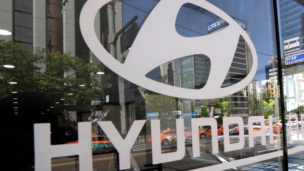 In this Wednesday, April 26, 2017, file photo, the logo of Hyundai Motor Co. is displayed at the automaker's showroom in Seoul, South Korea. Hyundai Motor Group on Wednesday says it has signed an agreement with Audi AG to jointly develop electronics vehicles powered by fuel cell. (AP Photo/Lee Jin-man, File)