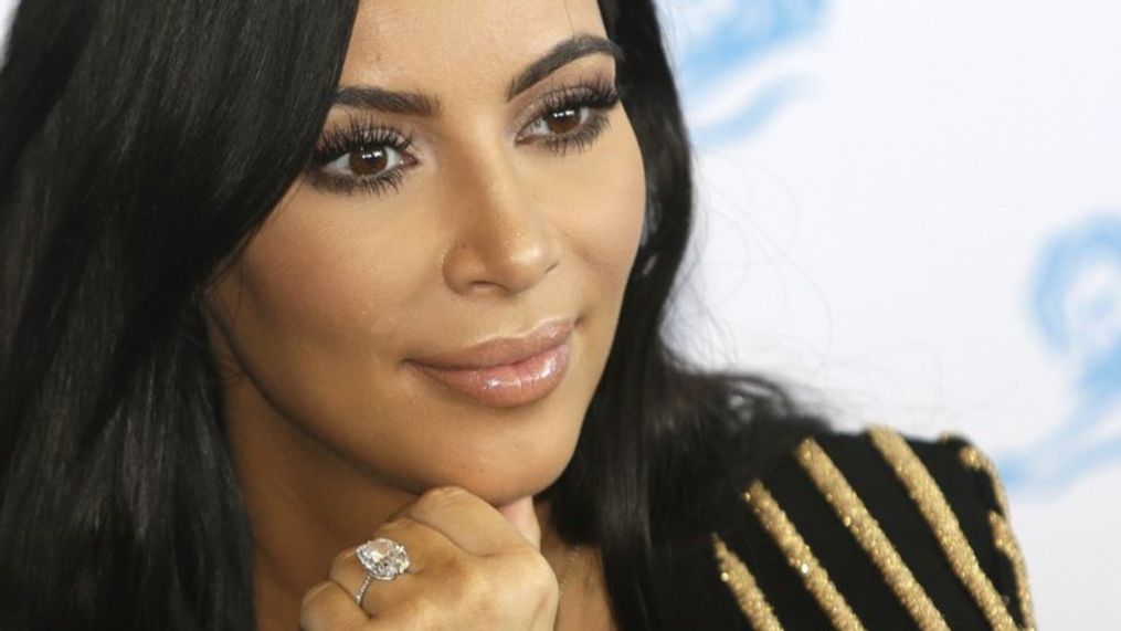 FILE - In this June 24, 2015 file photo, American TV personality Kim Kardashian attends the Cannes Lions 2015, International Advertising Festival in Cannes, southern France. Kardashian discussed her experience being held at gunpoint during a Paris jewelry heist last year during an episode of E!'s “Keeping Up with the Kardashians” that aired on Sunday, March 19, 2017. (AP Photo/Lionel Cironneau, File)