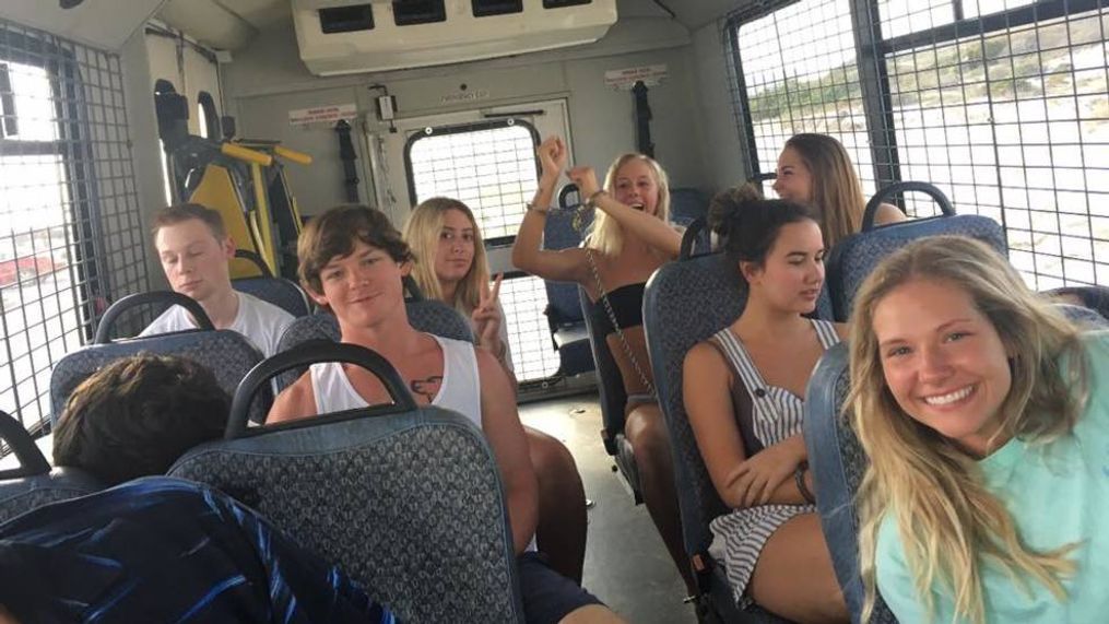 (IMG:OCSO){ }OCSO shares photo of arrested spring breakers being happily carried to jail