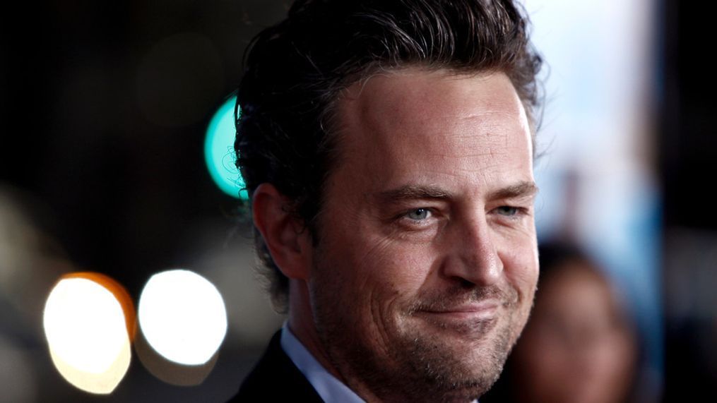 FILE - Matthew Perry arrives at the premiere of "The Invention of Lying" in Los Angeles on Monday, Sept. 21, 2009. Perry, who starred as Chandler Bing in the hit series âFriends,â has died. He was 54. The Emmy-nominated actor was found dead of an apparent drowning at his Los Angeles home on Saturday, according to the Los Angeles Times and celebrity website TMZ, which was the first to report the news. Both outlets cited unnamed sources confirming Perryâs death. His publicists and other representatives did not immediately return messages seeking comment. (AP Photo/Matt Sayles, File)