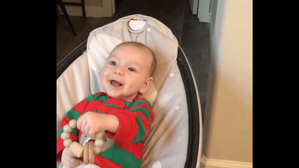 Baby William 'sings' jingle bells as his grandmother hums the tune. (Courtesy: Kathy Evans Jones)