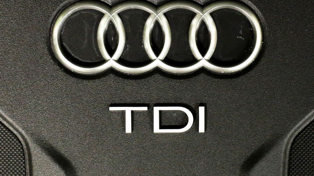 The Sept. 28, 2015 file photo shows the sign of German car company Audi attached on the engine of a TDI, a turbo diesel model, in Berlin, Germany. Audi accepted a fine of 800 million euro (927 million US$) for it's involvement in the Diesel scandal. (AP Photo/Markus Schreiber, file)