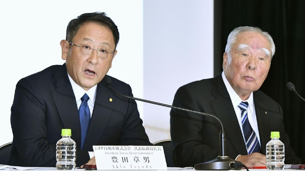 Toyota Motor Corp. President Akio Toyoda, left, speaks with Suzuki Motor Corp. Chairman Osamu Suzuki during an October news conference in Tokyo.  Japanese automakers Toyota and Suzuki say they have decided to work together in ecological and safety technology — a rapidly growing area in the industry. (Shigeyuki Inakuma/Kyodo News via AP, File)