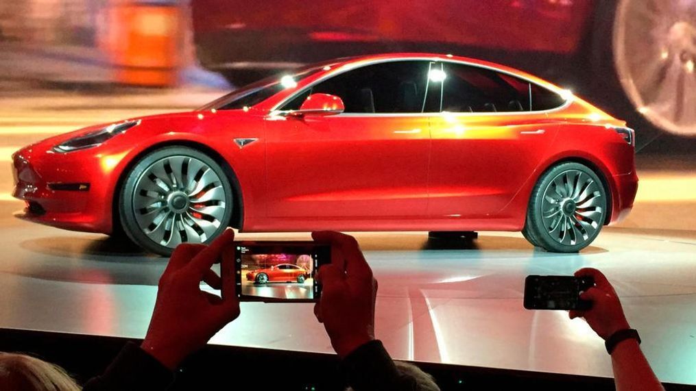 FILE- In this March 31, 2016, file photo, Tesla Motors unveils the new lower-priced Model 3 sedan at the Tesla Motors design studio in Hawthorne, Calif.{&nbsp;} (AP Photo/Justin Pritchard, File)