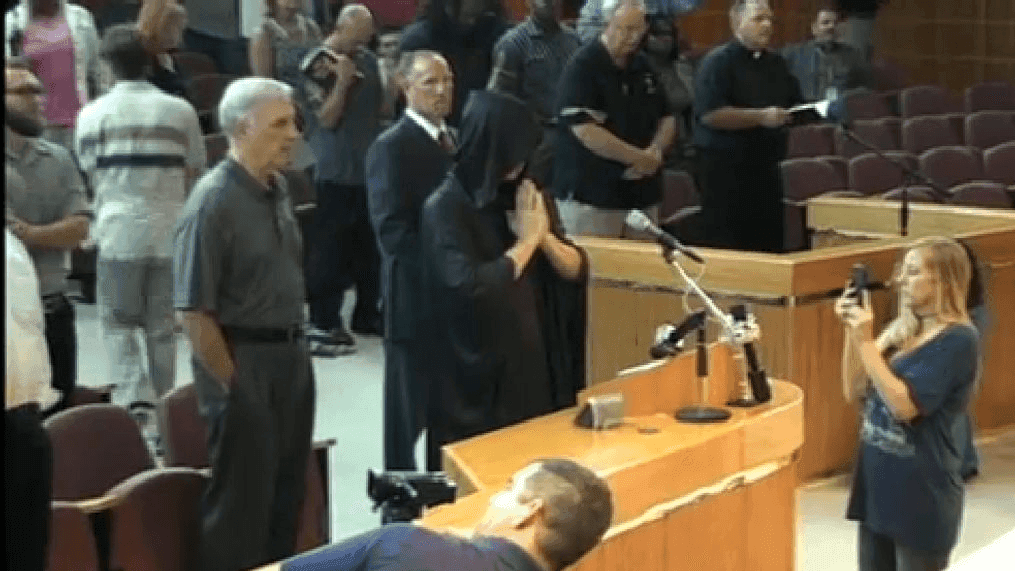 A satanic prayer was disrupted during a city council meeting in Pensacola, Fla. Thursday, July 14, 2016. (WEAR)