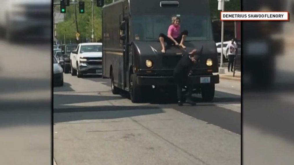 A still from a video showing a woman hitting a man with a windshield wiper of a UPS truck on Branch Avenue in Providence. (Courtesy of Demetrius Shavoo Flenory) 