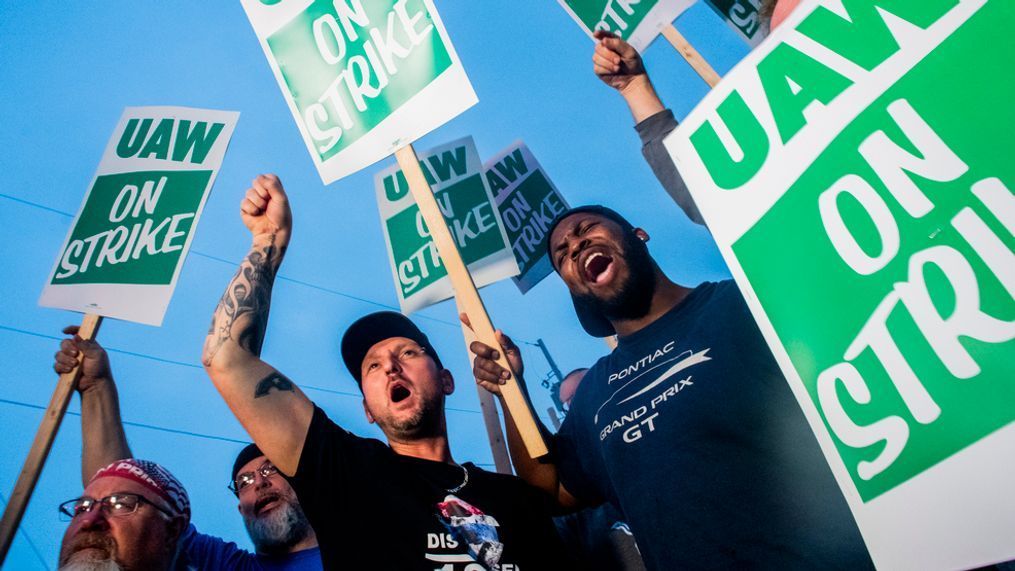 General Motors employees Bobby Caughel, left, and Flint resident James Crump, shout out as they protest with other GM employees, United Auto Workers members and labor supporters outside of the Flint Assembly Plant on Monday, Sept. 16, 2019 in Flint, Mich. Thousands of members of the United Auto Workers walked off General Motors factory floors or set up picket lines early Monday as contract talks with the company deteriorated into a strike. (Jake May/The Flint Journal via AP)