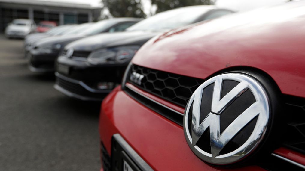 Display cars are parked at a Volkswagen dealership in Sydney, Monday, Sept. 16, 2019. Volkswagen has agreed to pay up to 127 million Australian dollars ($87 million) to settle an Australian class action stemming from the 2015 diesel emissions scandal, the German automaker and a lawyer said Monday. (AP Photo/Rick Rycroft)