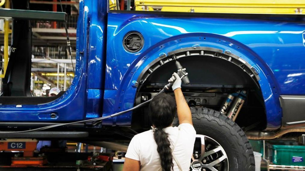 In file photo a United Auto Workers assemblyman works on a 2018 Ford F-150 truck being assembled at the Ford Rouge assembly plant in Dearborn, Mich. Ford Motor Co. reports earnings Wednesday, Oct. 24. (AP Photo/Carlos Osorio, File)